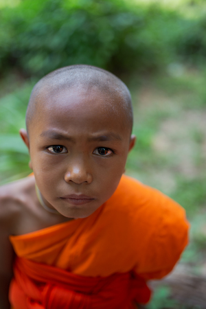 Eyes of faith little novice monk in asian の写真素材