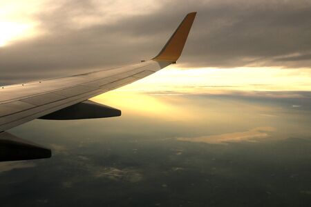 View from airplane window sunrise timeの写真素材
