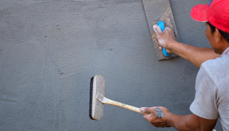 Plastering concrete with the wall and The building, with concrete for house construction.の写真素材