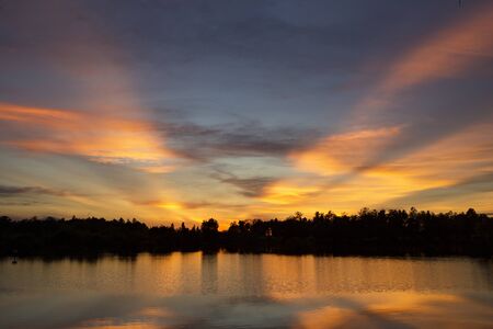 Natural sunset or sunrise at ocean or the lake の写真素材