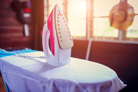 Electric iron put on the cushion clothの写真素材