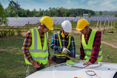 The technical team is planning the operation at the Solar Panel Farm.の写真素材
