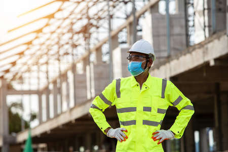 Engineering and supervisor working together in the construction site and maskedの写真素材