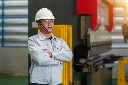 The worker in the uniform machine shop