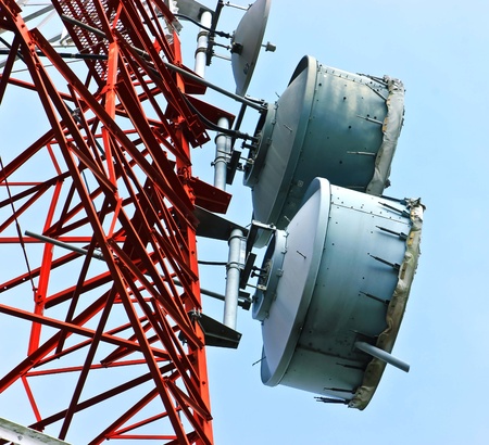 low angle view of  telecommunications towers against the skyの写真素材