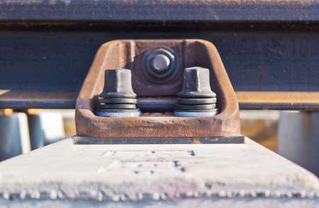 Steel nuts on the side of a train s exterior     の写真素材
