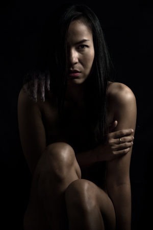 girl in a dirty robe, hand of death, nightmares, insomnia, a mentally ill woman, halloween themeの写真素材