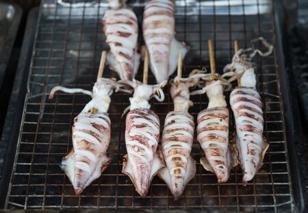 Grilled squid at market Street foods thailand. food conceptの写真素材