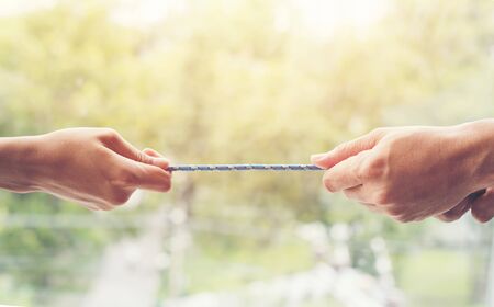 hand pulling rope for show power of group conceptの写真素材