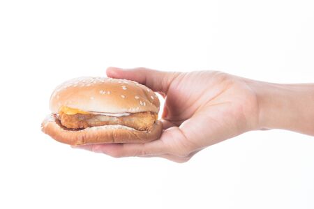woman Hands holding a hamburger  isolated on white backgroundの写真素材