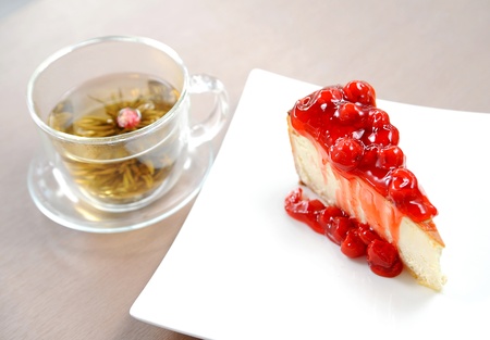 Cheesecake on a plate and tea cupの写真素材