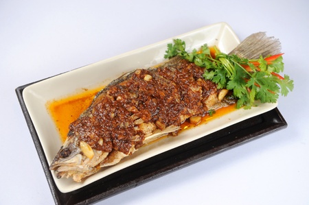 fried fish with fresh herbsの写真素材