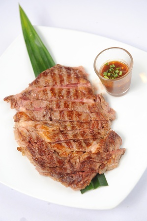 Grilled beef steaks isolated over white background setの写真素材