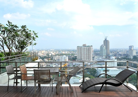 Armchairs and a table on an open terraceの写真素材