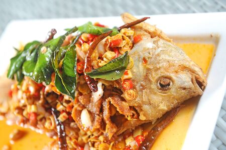 fried fish with fresh herbs and spicyの写真素材