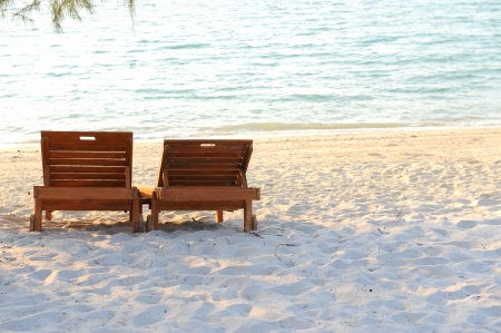 beach chairs at tropical beachの写真素材