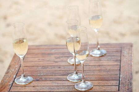 glass white wine at the beachの写真素材