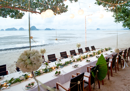 the tables are set for a romantic wedding receptionの写真素材