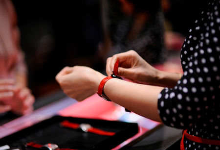 wrist watch on her arm in shopの写真素材