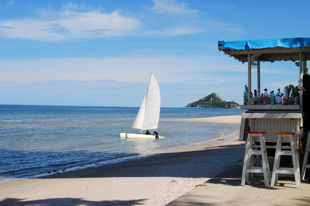 tropical beach with a bar on the beach and yachtの写真素材