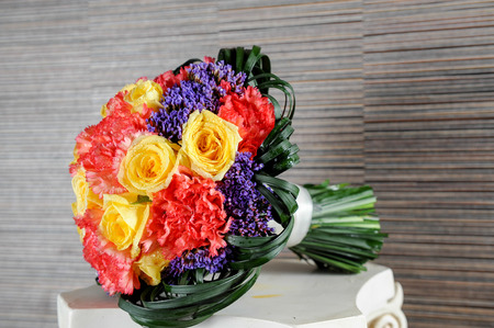 Bridal bouquet with  yellow roses and different flowerの写真素材