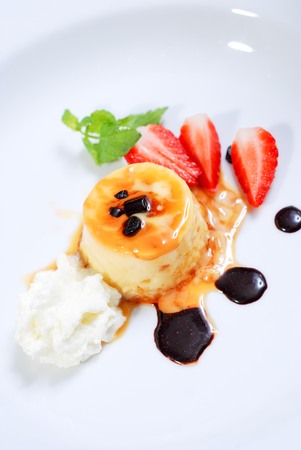 Cream pudding with strawberry and basilの写真素材