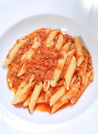 Pasta Penne with beef and Basilの写真素材