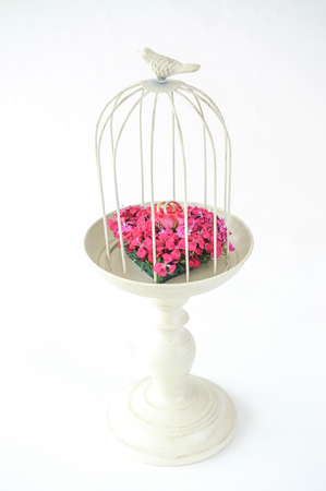 Beautiful flower wedding set up with ring on cageの写真素材