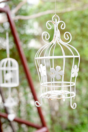 decorative cage in the gardenの写真素材