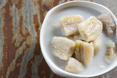 Banana in Coconut Milk. Traditional dessert of asian Thailand.の写真素材