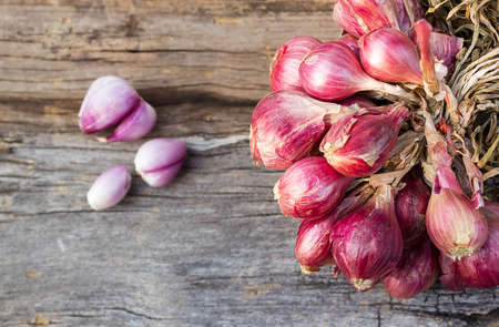 Red onion on old wood background.の写真素材