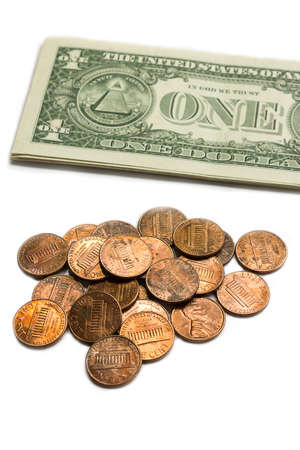 Us coins and dollar bills on white background.