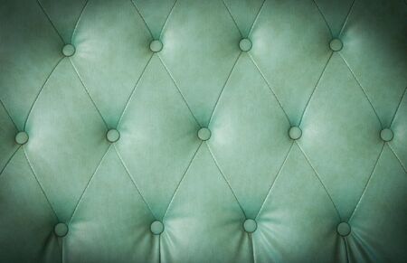 Background of a old leather armchair. Green color.の写真素材