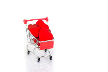 Red heart shape on cart. On white background with copy space. Concept, Cart of love. Valentine event.の写真素材