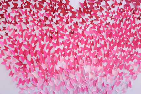 pink butterfly form paper backggroundの写真素材