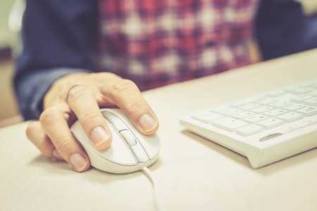 hand on mouseの写真素材