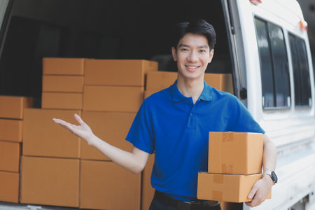 Truck Mover Unloading Van Carrying Boxes And Moving Houseの写真素材