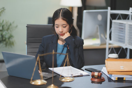 female business woman lawyers working at the law firms. Judge gavel with scales of justice. Legal law, lawyer, documents, advice and justice concept.の写真素材