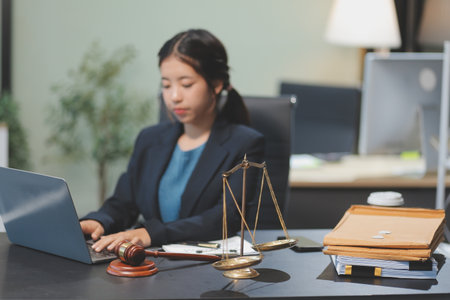 female business woman lawyers working at the law firms. Judge gavel with scales of justice. Legal law, lawyer, documents, advice and justice concept.の写真素材