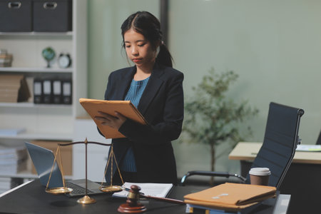 female business woman lawyers working at the law firms. Judge gavel with scales of justice. Legal law, lawyer, documents, advice and justice concept.の写真素材