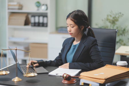 female business woman lawyers working at the law firms. Judge gavel with scales of justice. Legal law, lawyer, documents, advice and justice concept.の写真素材