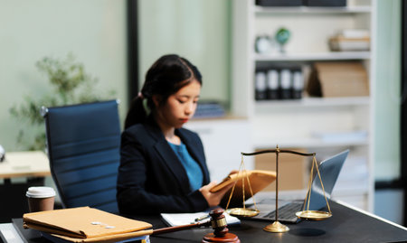 female business woman lawyers working at the law firms. Judge gavel with scales of justice. Legal...