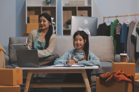 Young asian women happy after new order from customer. Surprise and shock face of asian woman success on making big sale of his online store. Online Selling. Online Shoppingの写真素材