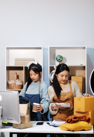 Young asian women happy after new order from customer. Surprise and shock face of asian woman...