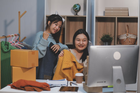 Young asian women happy after new order from customer. Surprise and shock face of asian woman success on making big sale of his online store. Online Selling. Online Shoppingの写真素材