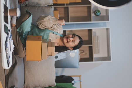 Young asian women happy after new order from customer. Surprise and shock face of asian woman...