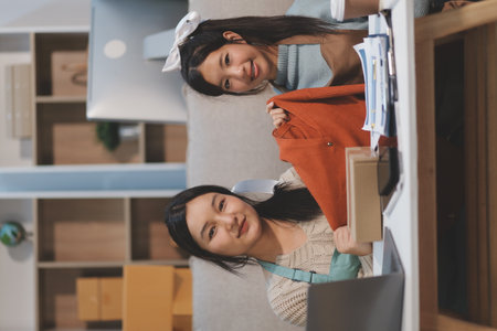 Young asian women happy after new order from customer. Surprise and shock face of asian woman success on making big sale of her online store.の写真素材