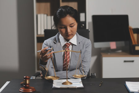 Law theme, mallet of the judge, law enforcement officers, evidence-based cases and documents taken into account.の写真素材