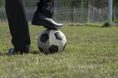 Businessman playing with soccer ball, Asian businessman with football in the stadium foolball, Soccer ballの写真素材