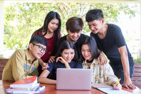 Back to school education knowledge college university concept, Young people being used computer and tablet, Education and technology concept.の写真素材
